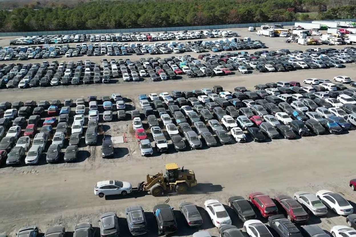 Drone view of rows of vehicles at a Copart yard