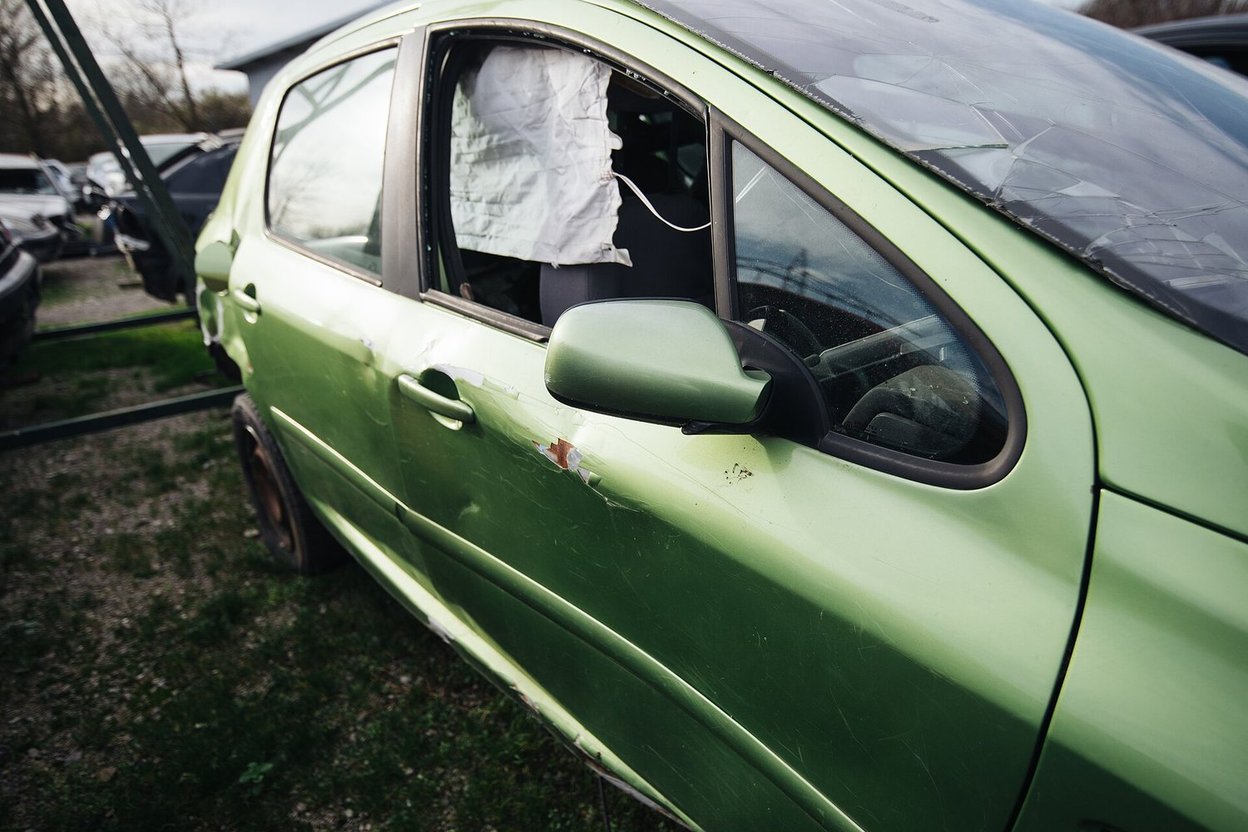 A damaged car at a salvage yard