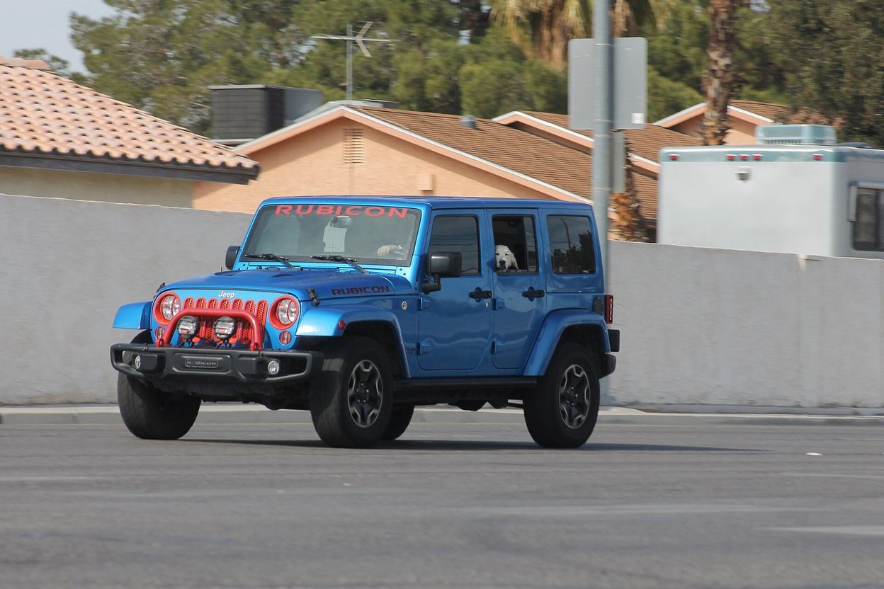 A blue Jeep Wrangler JK Rubicon four-door
